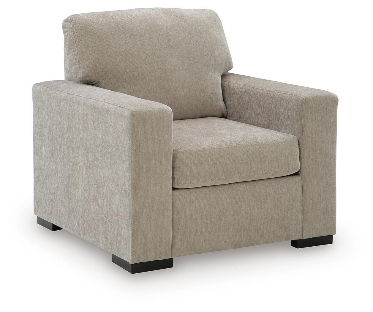 Upholstered armchair in light gray fabric with padded seat and squared arms