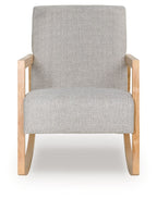 Gray upholstered accent chair with wide back, light wood legs and armrests