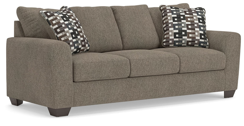 Triston-Peaks suede sofa in gray with two geometric check throw pillows