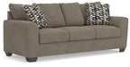 Triston-Peaks suede sofa in gray with two geometric check throw pillows