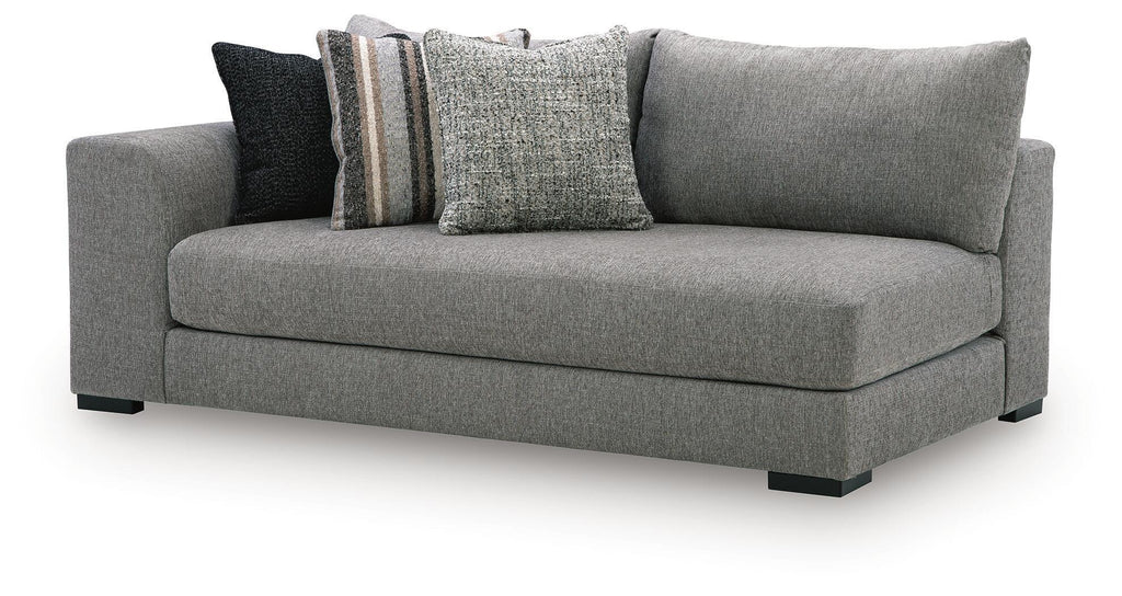 Gray chaise sectional corner with rolled arms and three throw pillows