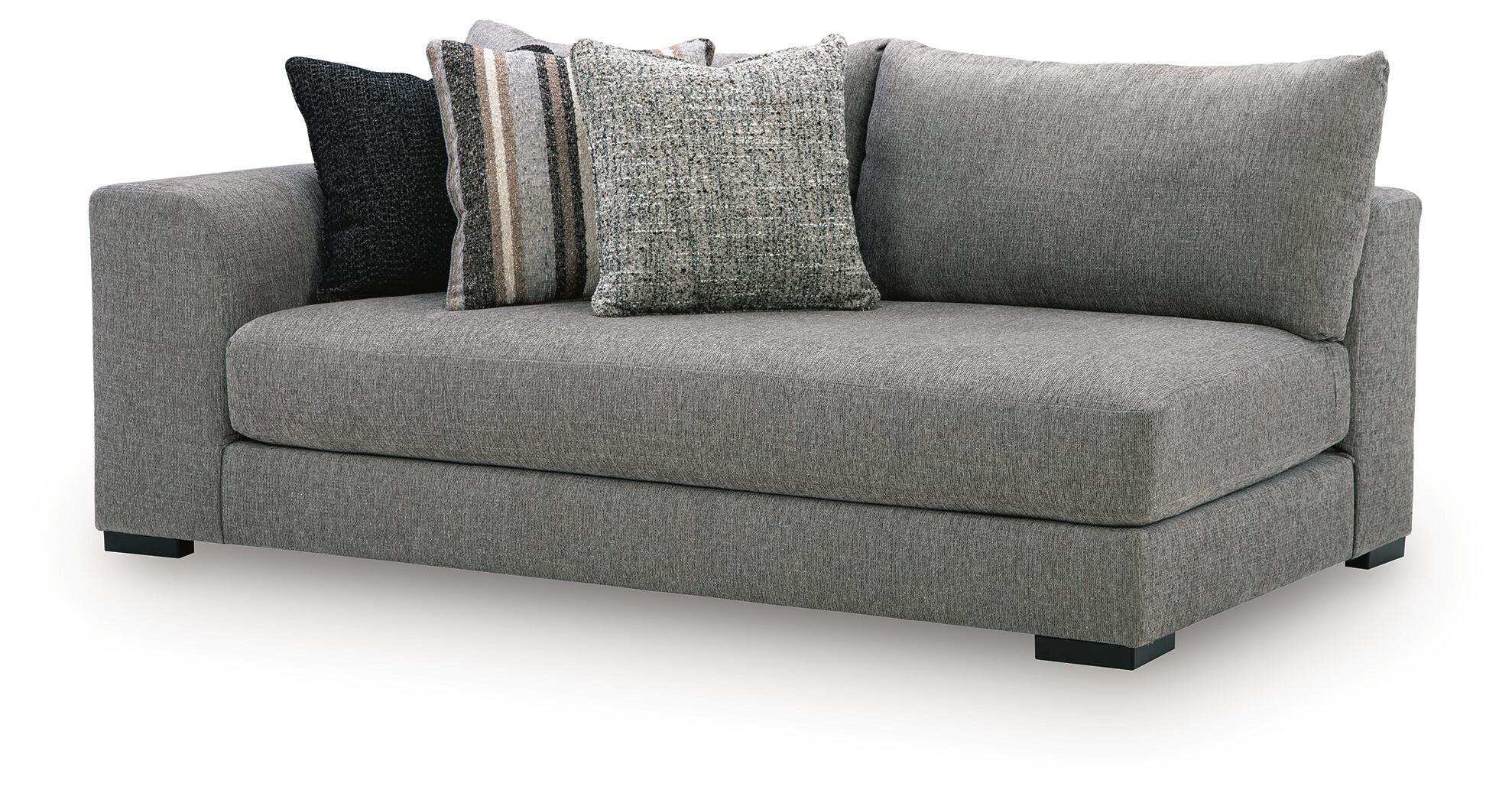 Gray chaise sectional corner with rolled arms and three throw pillows