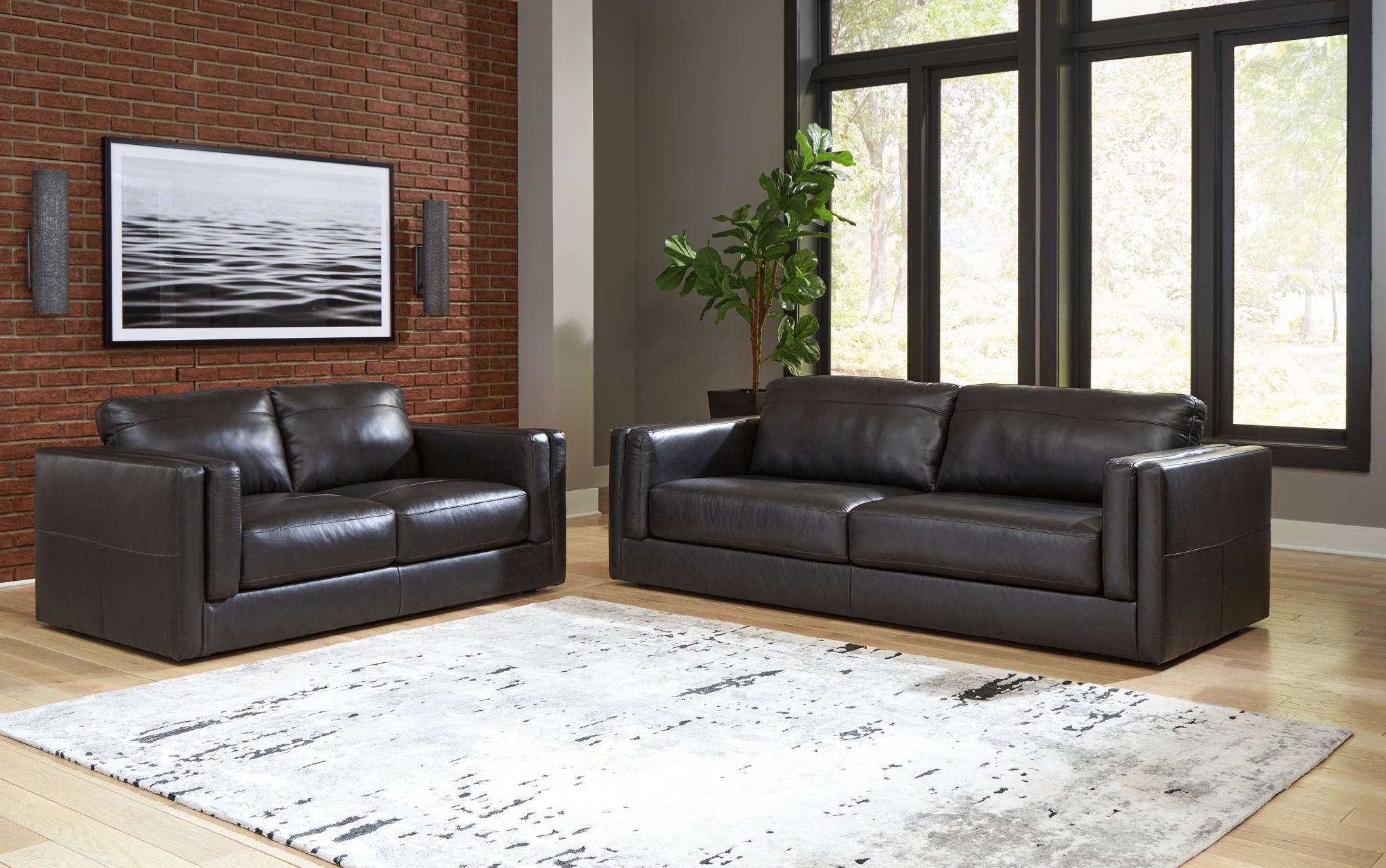 Black leather sofa and loveseat set with square arms
