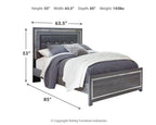 Gray upholstered panel bed with button-tufted headboard and drawer base
