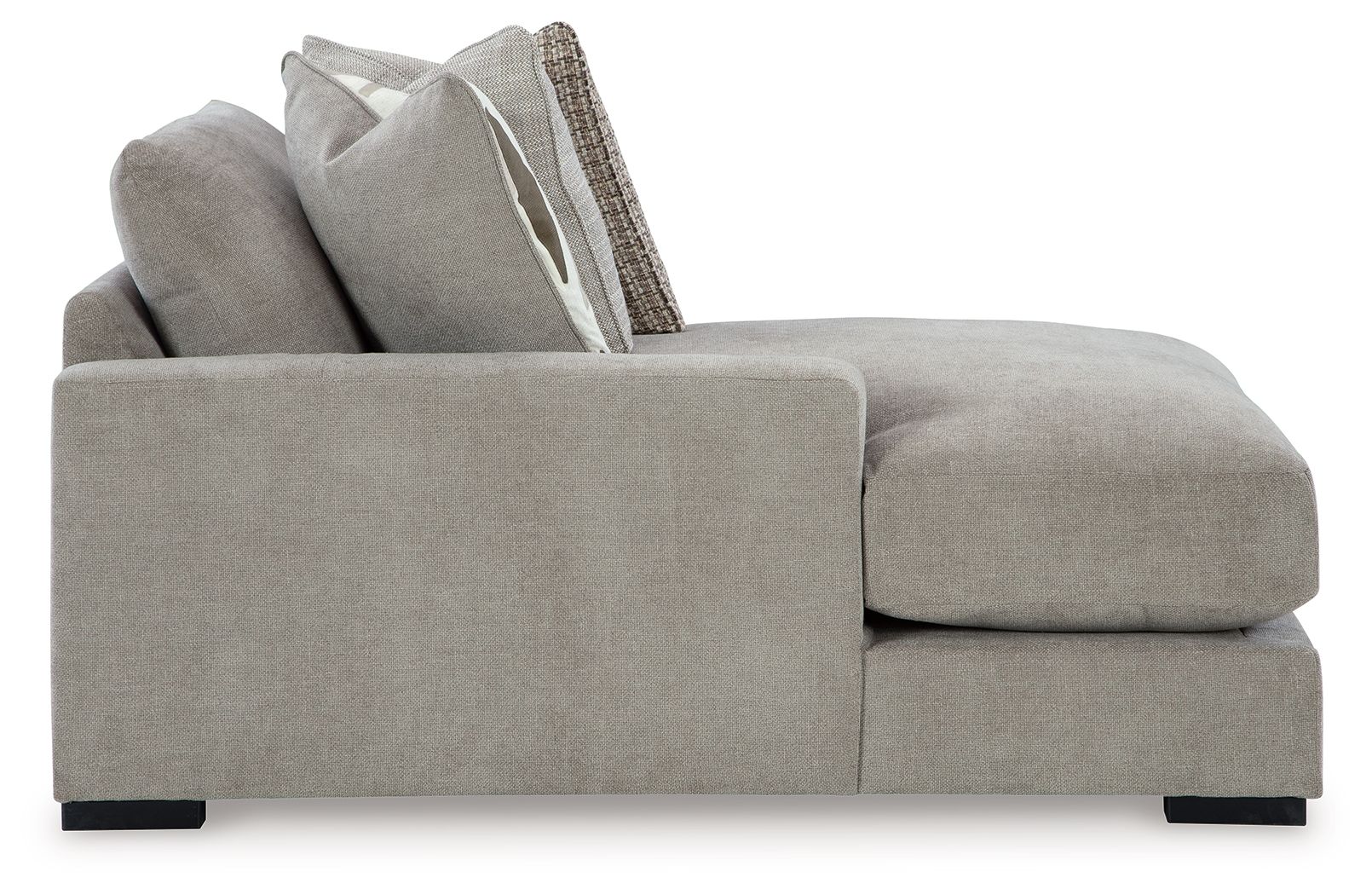 Pebble gray corner chaise with armrests, chaise cushion, and raised back pillows