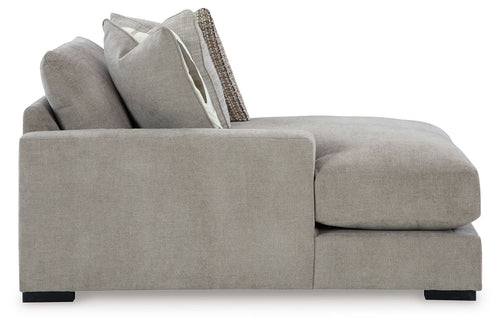 Pebble gray corner chaise with armrests, chaise cushion, and raised back pillows