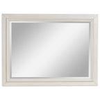 Antique white framed mirror with wide trim and reflective glass panel