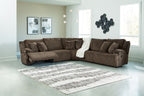 Brown ribbed reclining sectional sofa with chaise and backrest cushions
