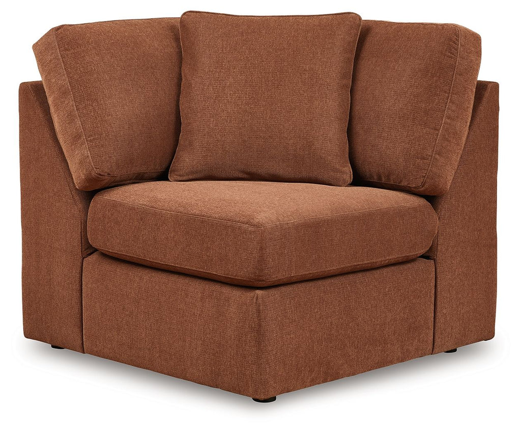 Brown fabric wedge armchair with three back cushions and square armrests