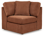 Brown fabric wedge armchair with three back cushions and square armrests
