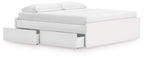 White platform bed with padded headboard and storage drawers