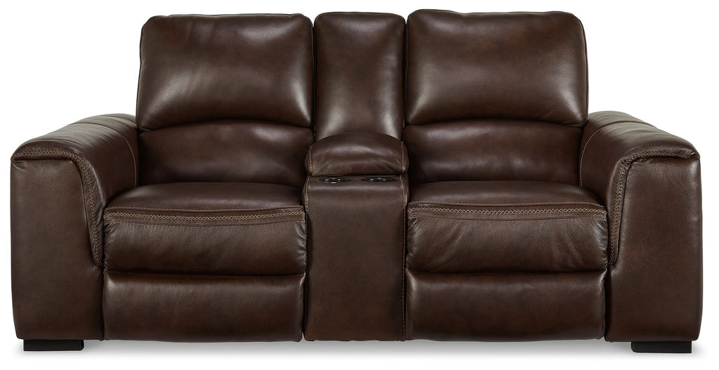 Brown leather loveseat with three cushioned seats, tufted back, and recliner arms.
