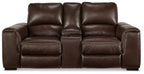 Brown leather loveseat with three cushioned seats, tufted back, and recliner arms.