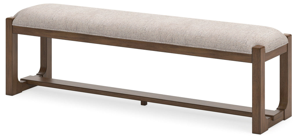 Upholstered dining bench with oatmeal fabric seat and light brown wood legs, three-quarter view