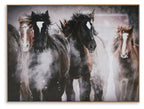 Framed wall art featuring three dark horses in a dusty scene