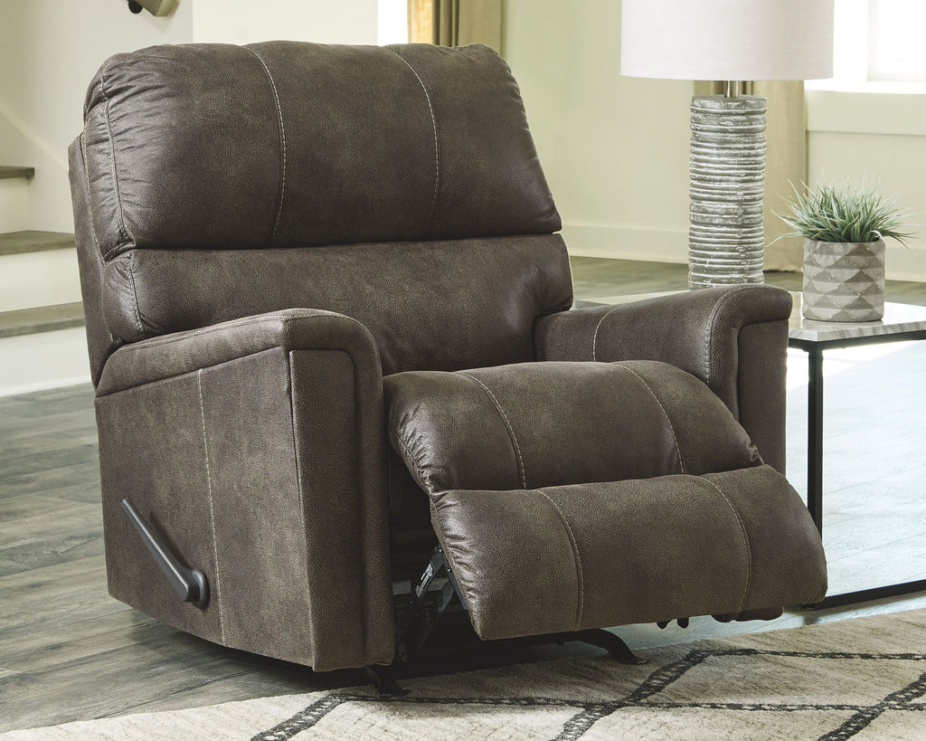Dark gray recliner chair with padded armrests and tufted backrest