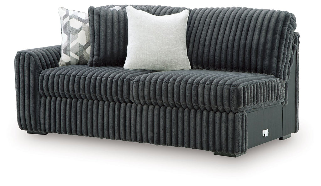 Ribbed corduroy sofa with left arm, gunmetal-gray upholstery and two throw pillows