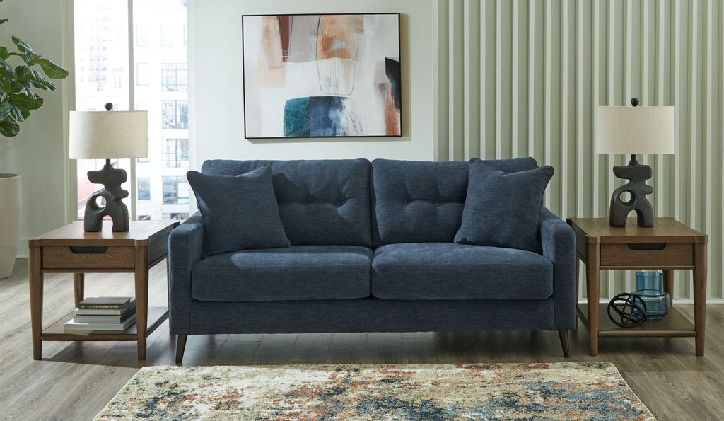 Navy blue sofa with square arms and four back cushions