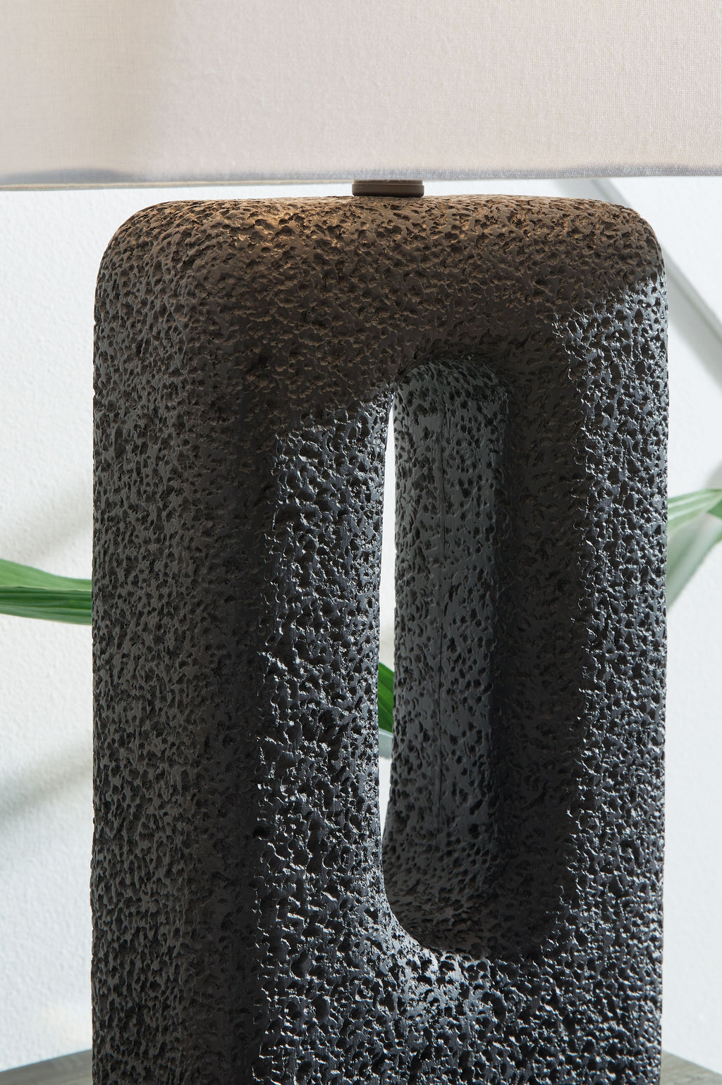 Black textured table lamp base with vertical oval cutout
