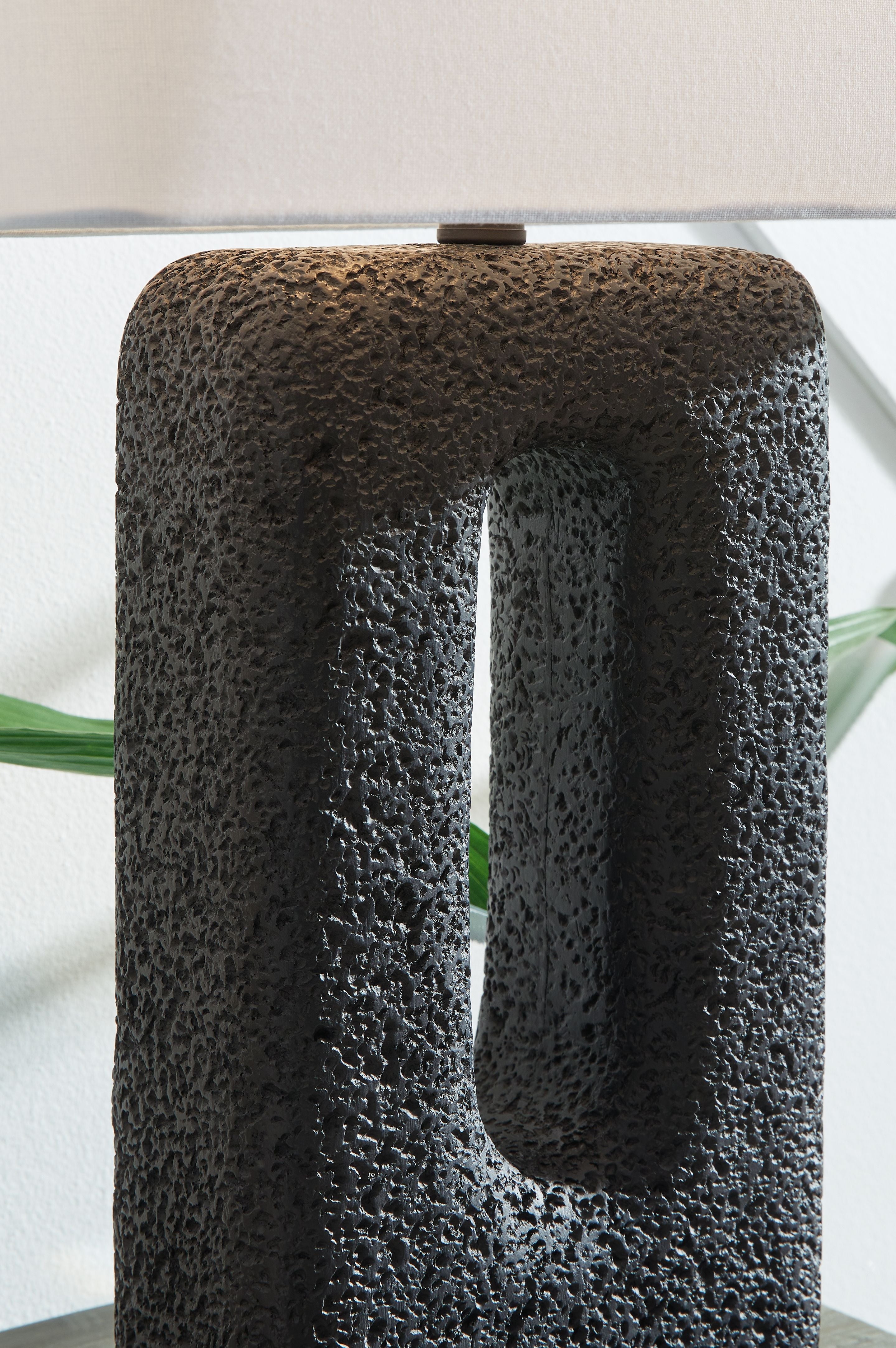 Black textured table lamp base with vertical oval cutout