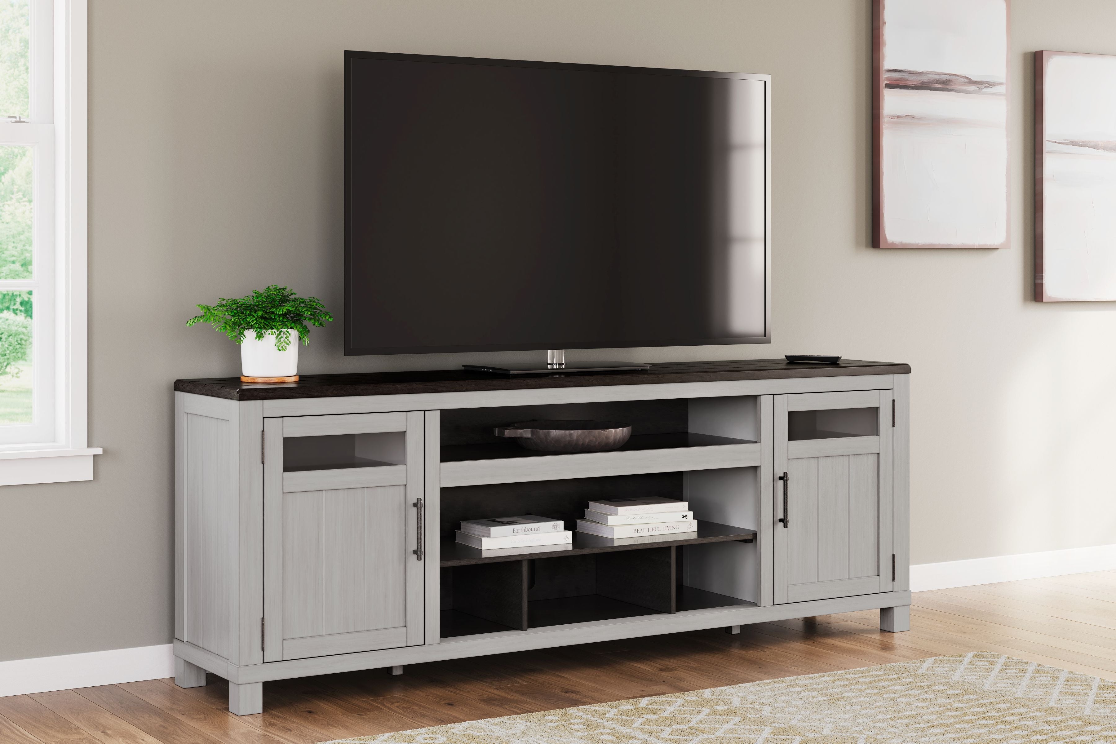 Gray TV stand with dark top, side cabinets and open middle storage for media