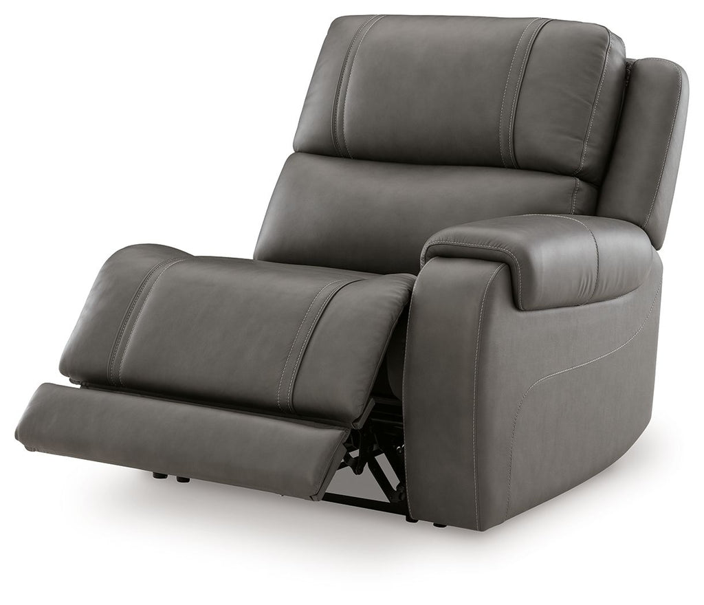 Gray power recliner with extended footrest, padded arms, and back cushion