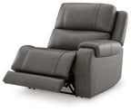 Gray power recliner with extended footrest, padded arms, and back cushion