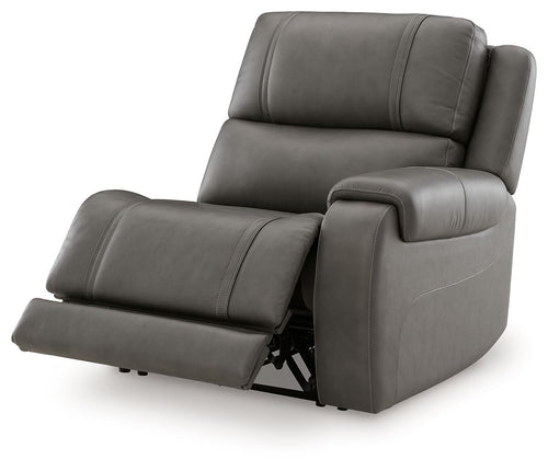 Gray power recliner with extended footrest, padded arms, and back cushion