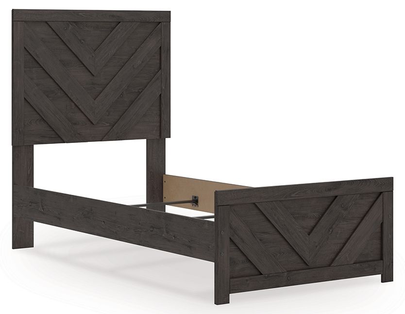 Panel bed with dark gray frame and chevron panel headboard, off-white mattress visible