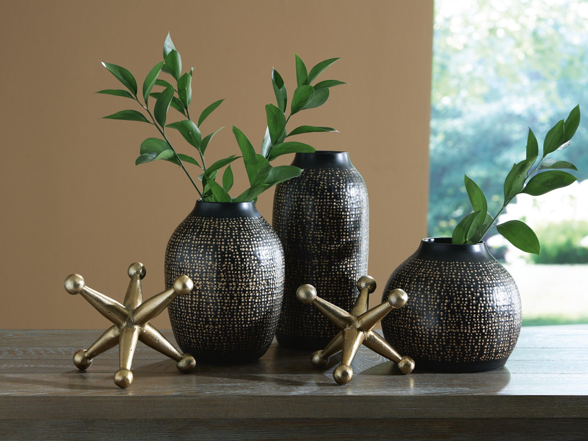 Vinburn accessory set black speckled vases with greenery and gold star-shaped bases