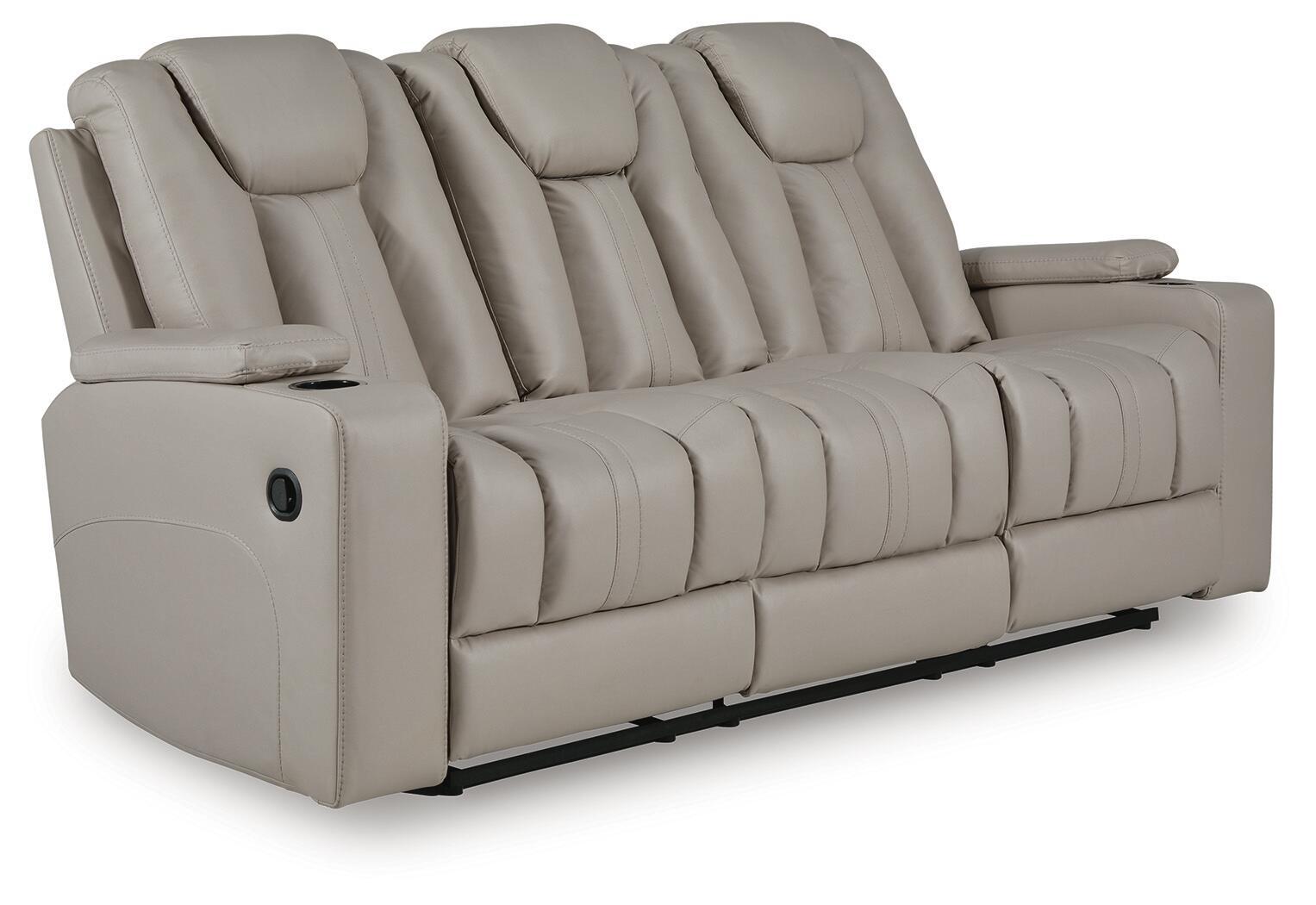 Reclining sofa in light beige upholstery with padded arms and tufted back