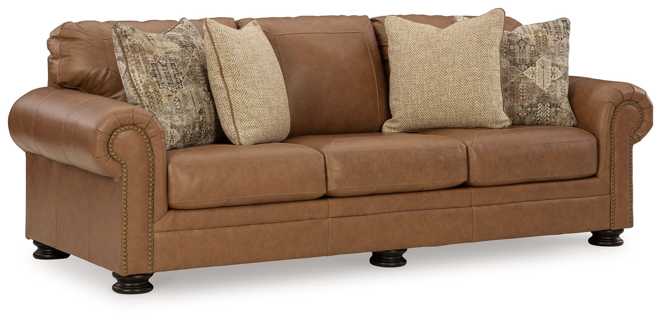 Caramel leather sofa with rolled arms, tufted seat cushions, and square throw pillows