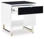 Rectangular end table with white frame and black drawer, top surface, open shelf, angled legs