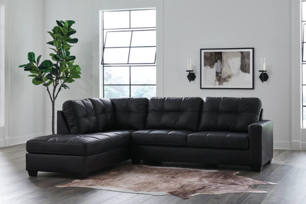 Dark charcoal sectional sofa with chaise corner, tufted back