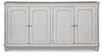 Antique white accent cabinet with four doors and rounded crown top moulding