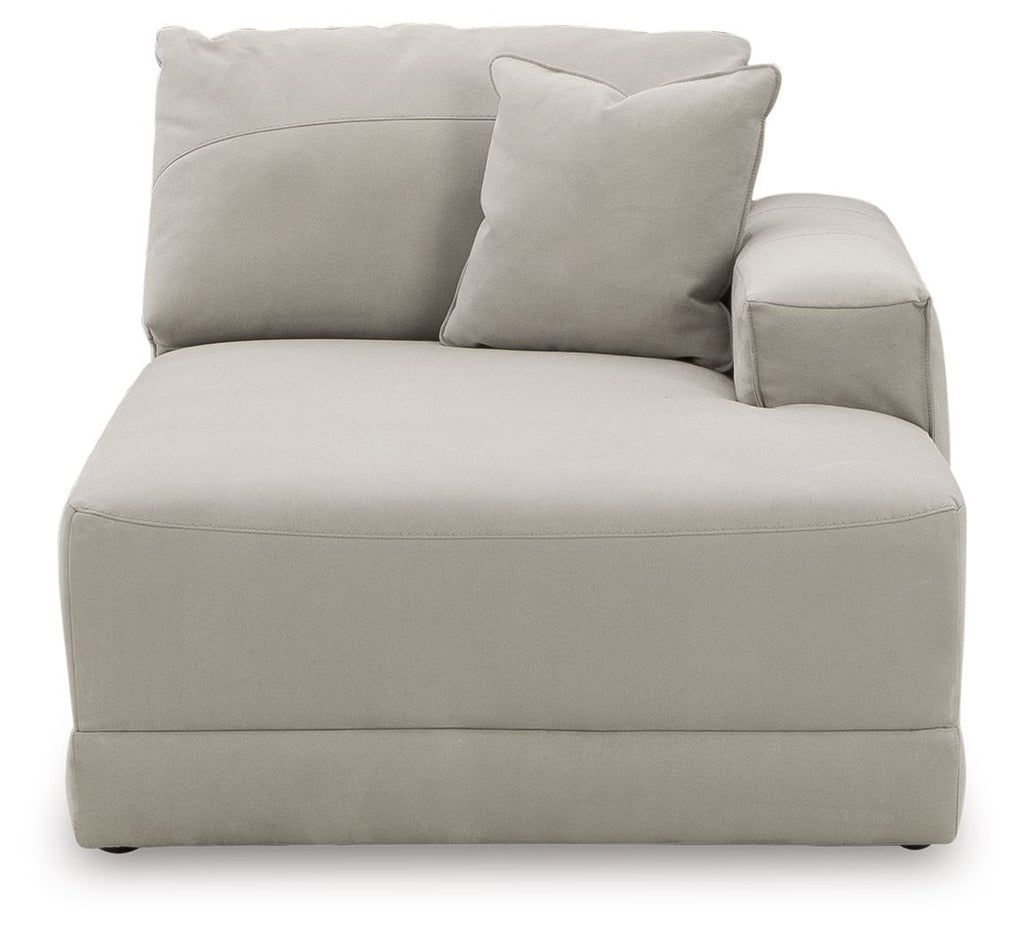 Gray upholstered corner chaise with thick seat cushion and large accent pillow