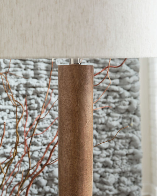 Wood floor lamp in natural brown wood with white fabric shade top section
