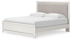 White upholstered panel platform bed with tall headboard and roll slats