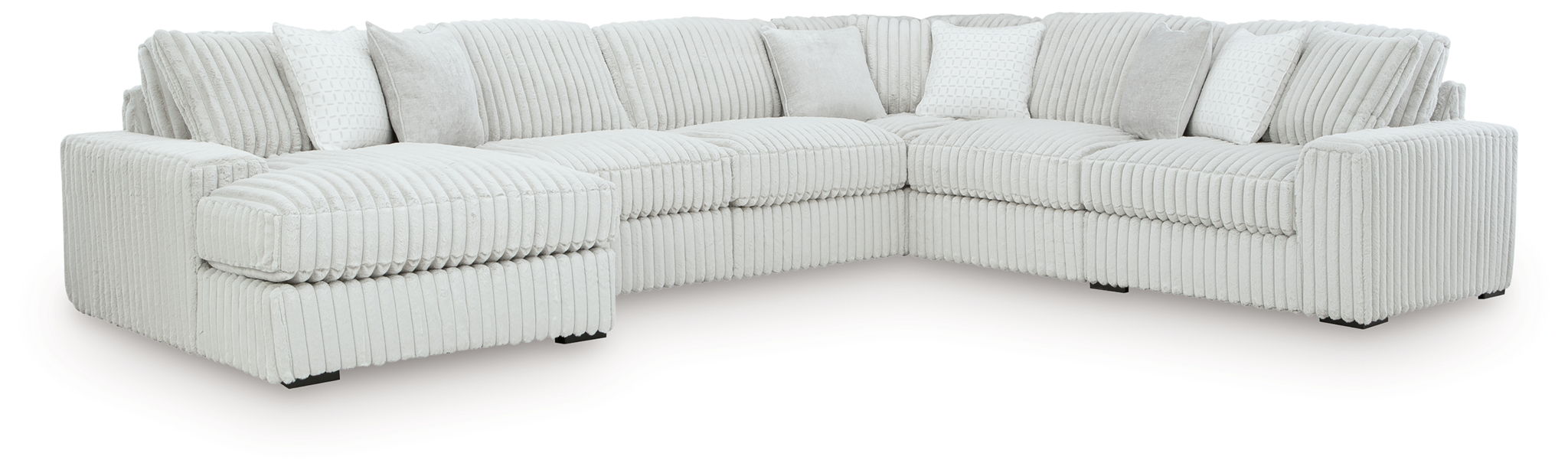 L-shaped sectional sofa with chaise, light-colored striped upholstery and back pillows