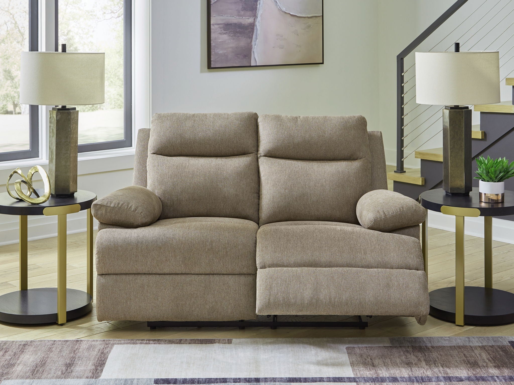 Beige reclining loveseat with rounded arms, tufted back cushions, and two seats