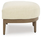 Beige-upholstered ottoman with dark brown wooden frame and tapered legs