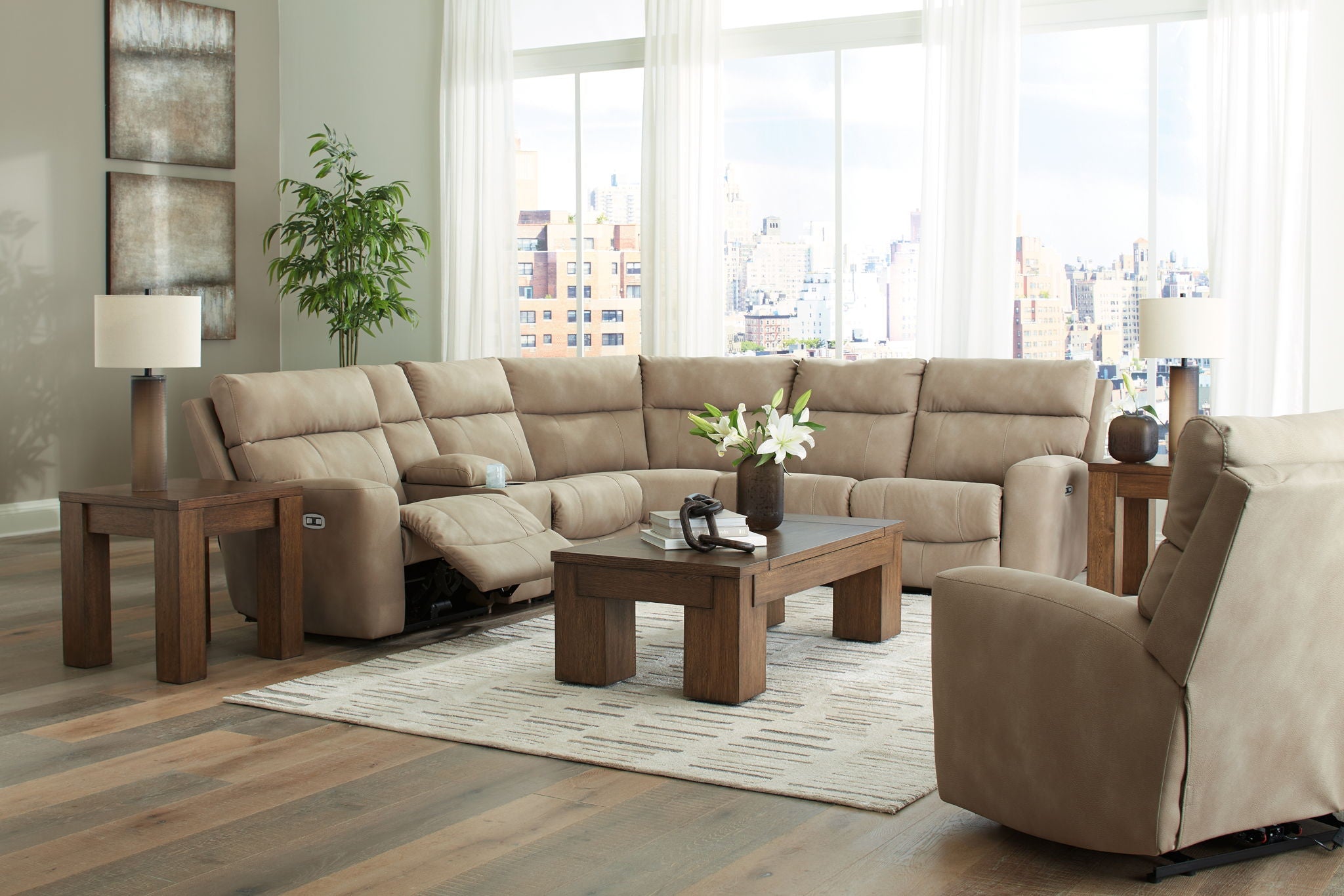 Beige power reclining sectional set with corner chaise and padded recliner arms