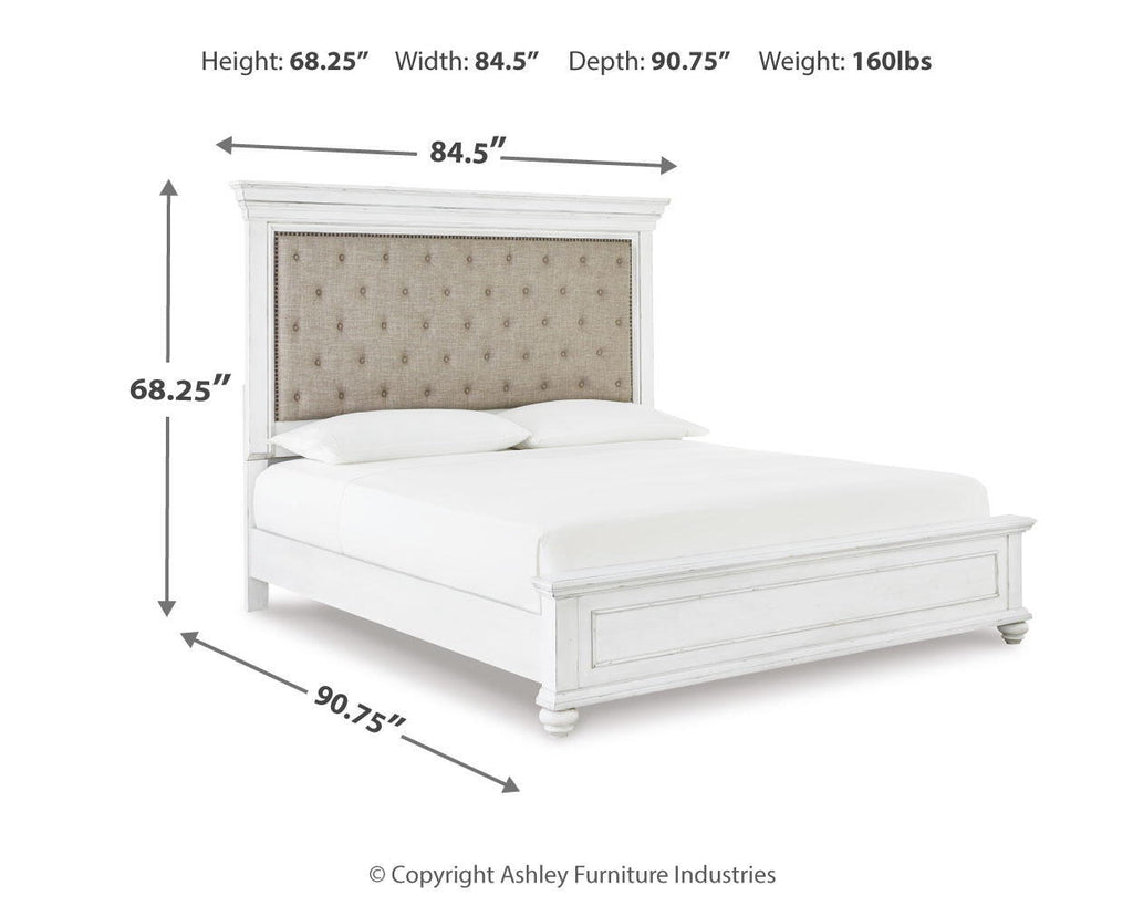 Upholstered panel bed in white with tufted beige headboard and low footboard