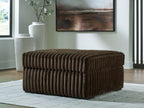 Oversized accent ottoman in chocolate brown, ribbed velvet texture, rounded top