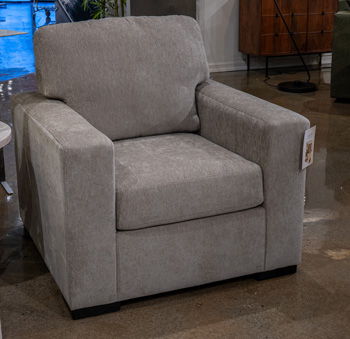 Gray fabric accent chair with wide arms and squared seat, cushioned backrest.