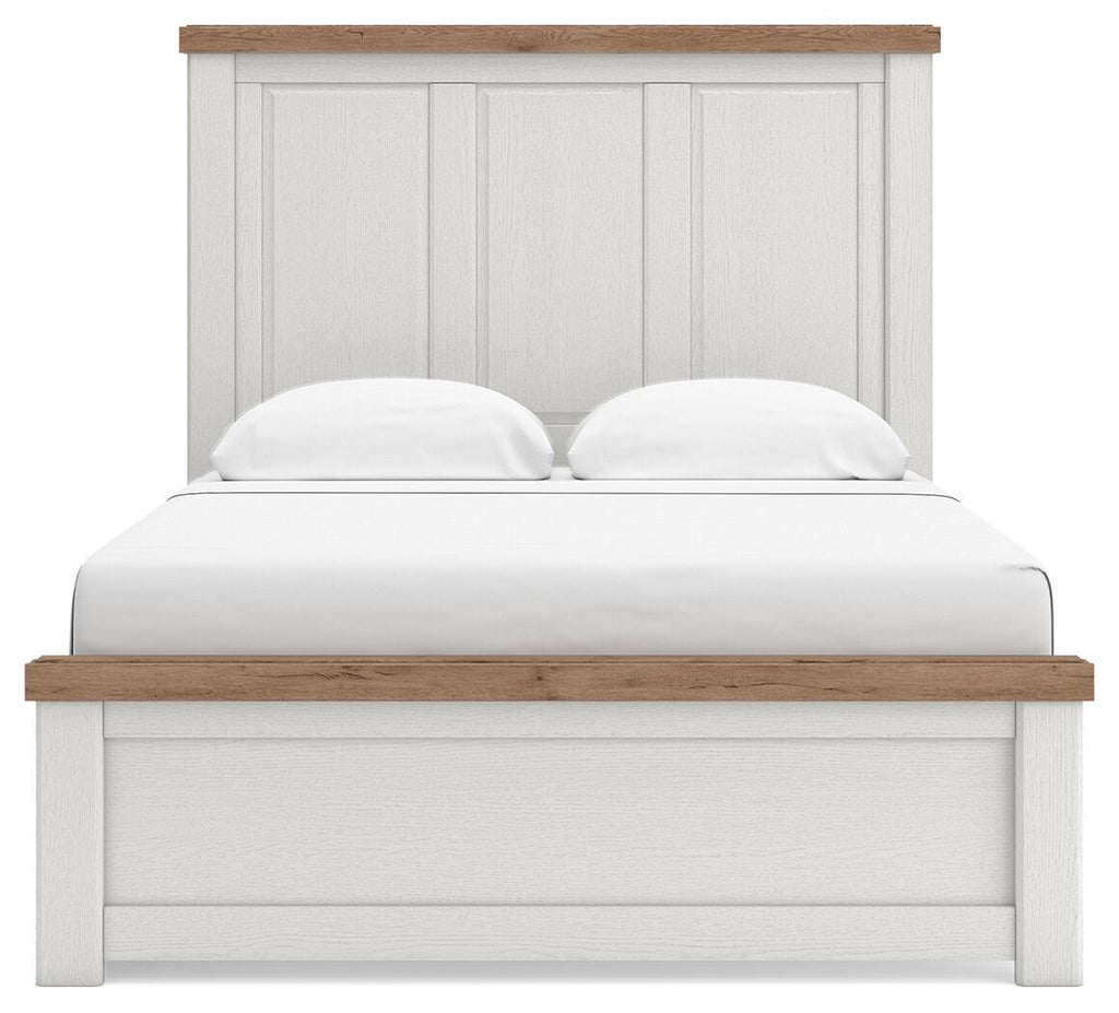 White panel storage bed with storage footboard, wood-trim headboard, and two pillows