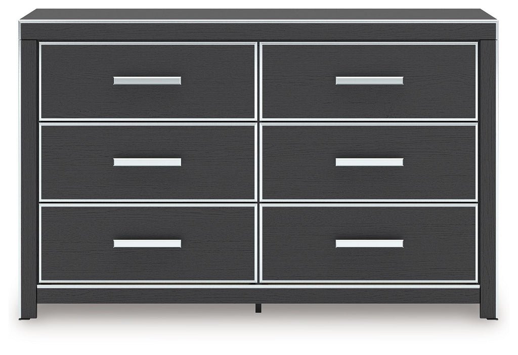 Black dresser with six drawers and metal bar pulls
