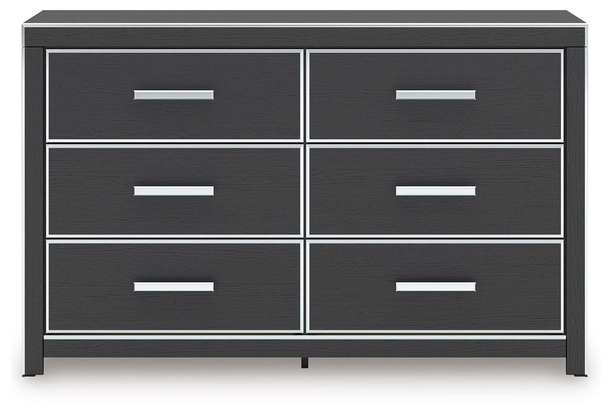 Black dresser with six drawers and metal bar pulls