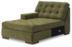 Olive green chaise with tufted backrest, thick seat cushion, and low wooden legs