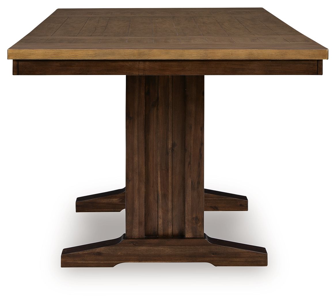 Rectangular counter-height extension table with brown wood top and pedestal base.